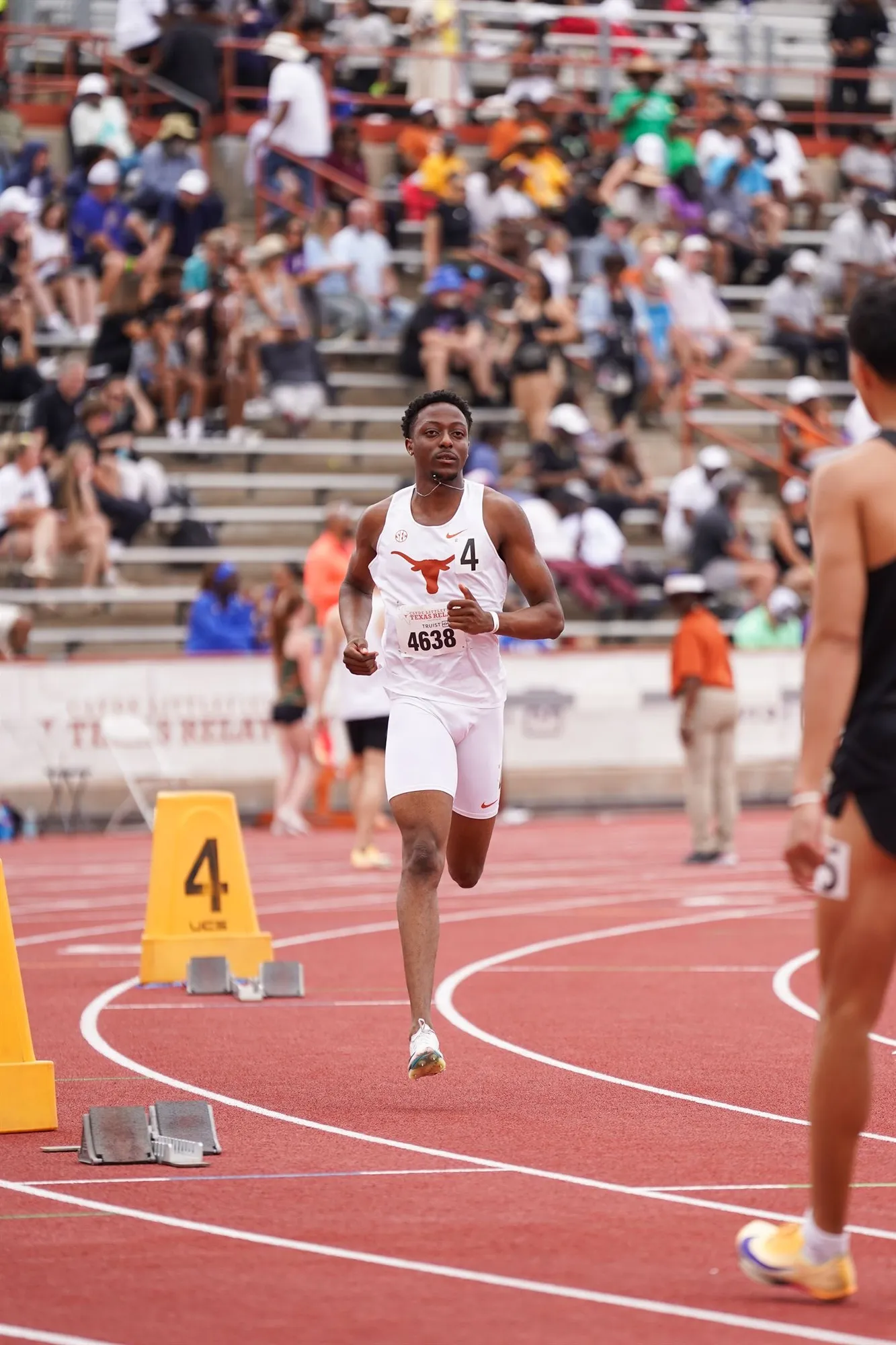 Sihle running for Texas in front of a packed stadium