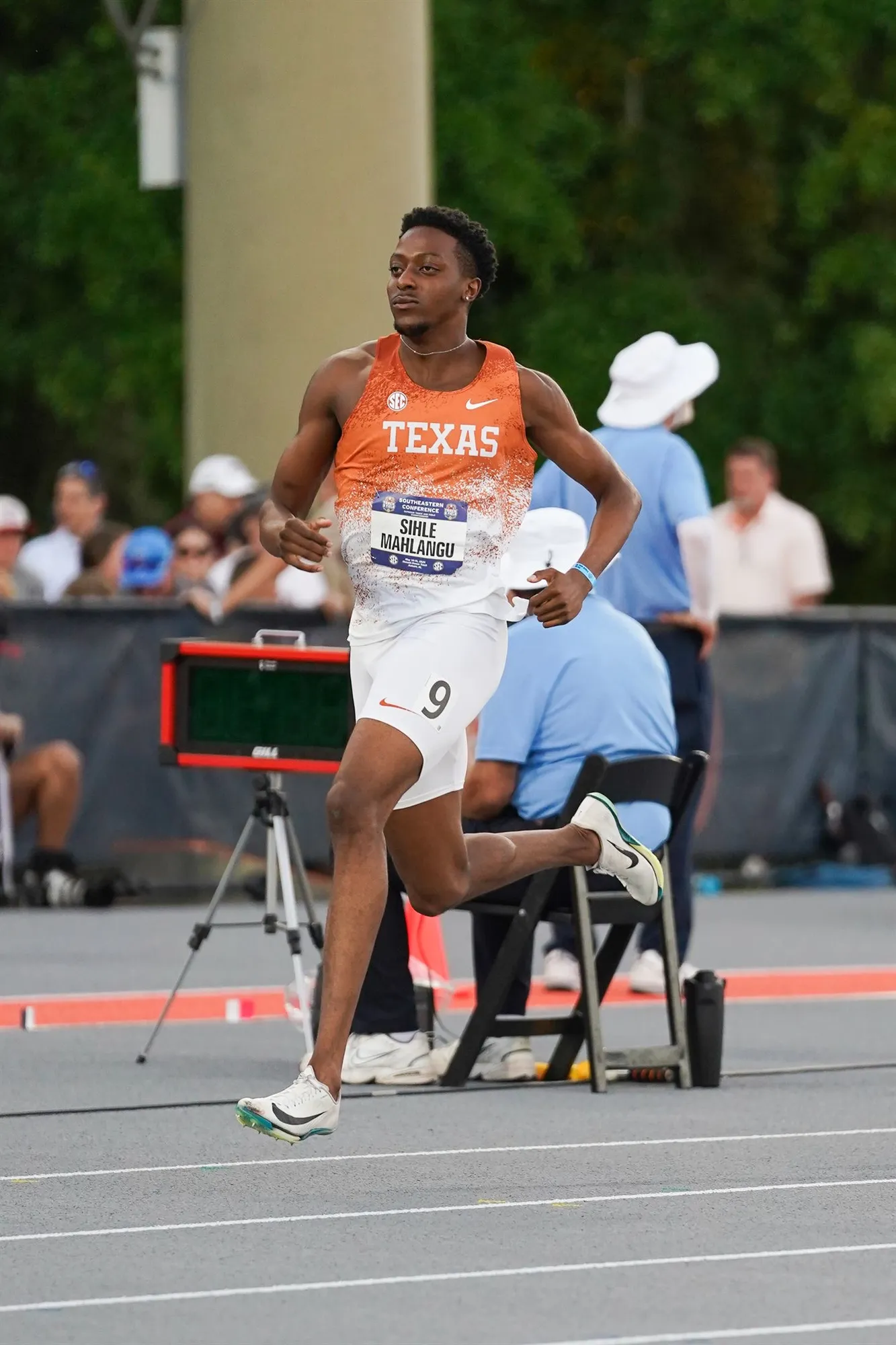 Sihle running a relay leg for Texas